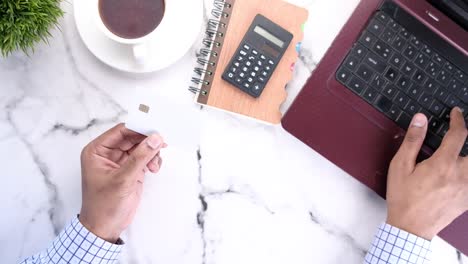 person holding credit card at workplace