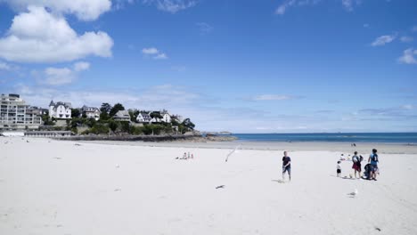 beach scene with people and buildings