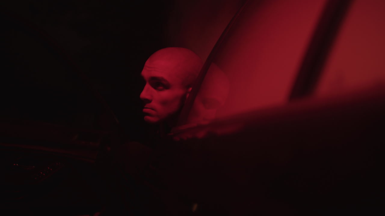 Man in a Car at Night