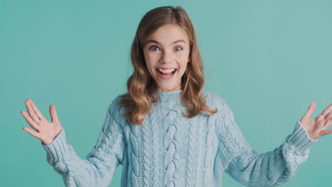 excited teenage caucasian girl in front of the camera.