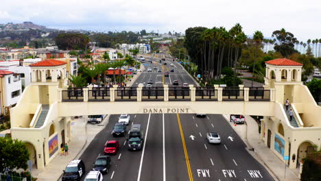 overhead view of dana point, california with pedestrian bridge and traffic