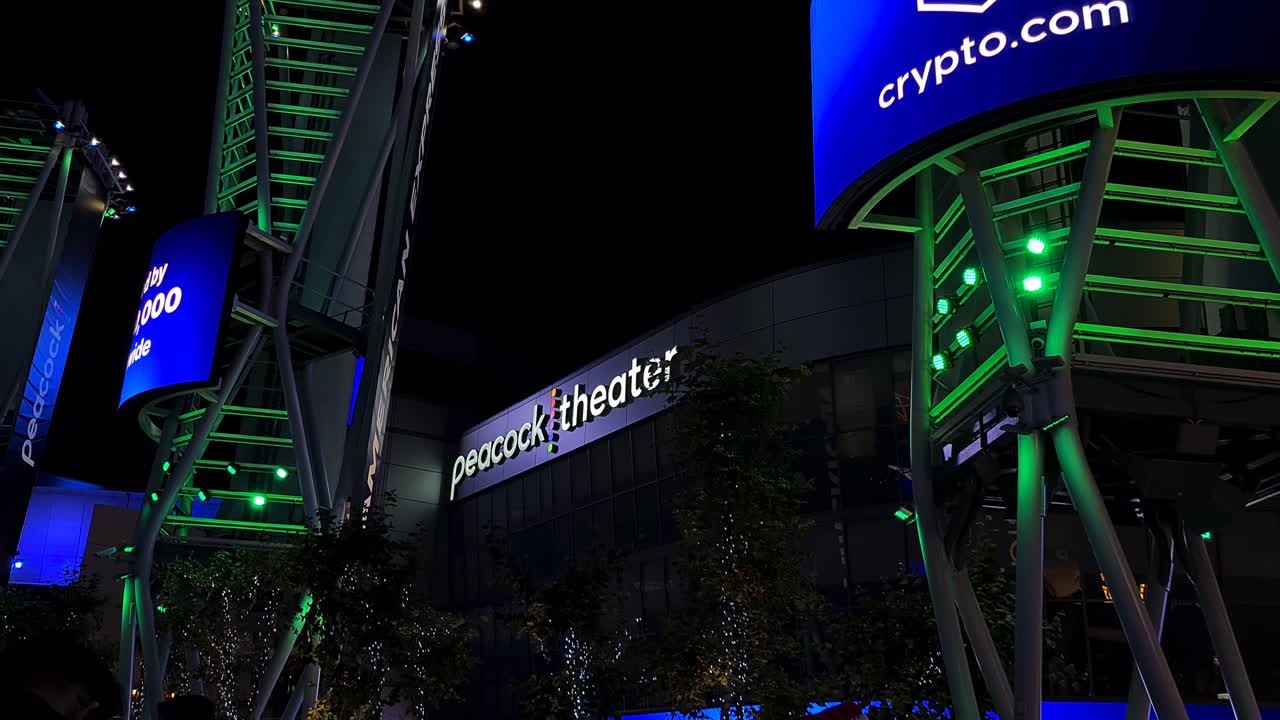 Peacock Theater at Night with Illuminated Signage and Urban Lights
