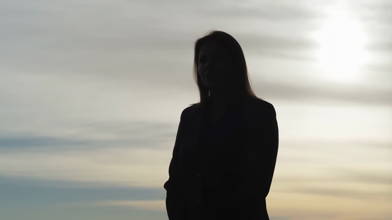 Woman's Silhouette Against a Bright Sky