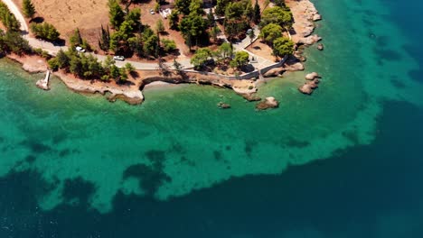 aerial of coastline with golden beach and bright turquoise sea near galaxidi, greece