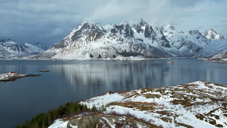 hyperlapse of the snow capped austnesfjorden mountains of lofoten with clouds streaming over the top