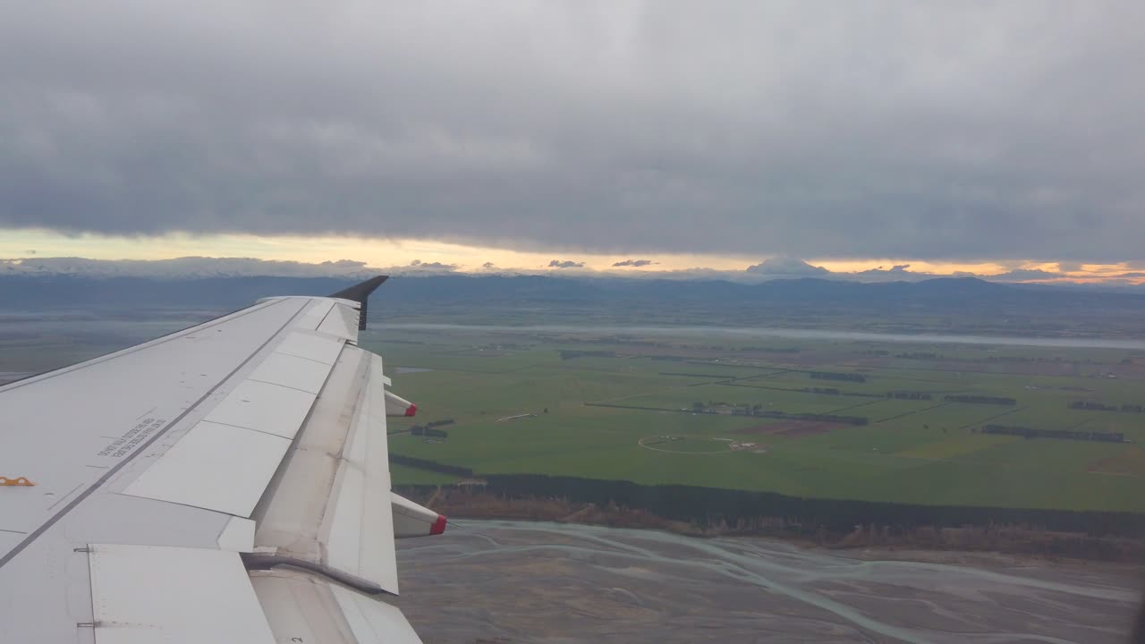 Airplane wing with flaps extending during flight