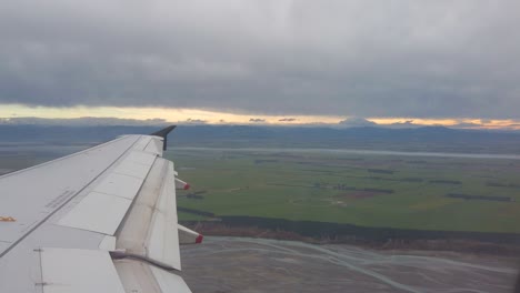 airplane wing with flaps extending during flight