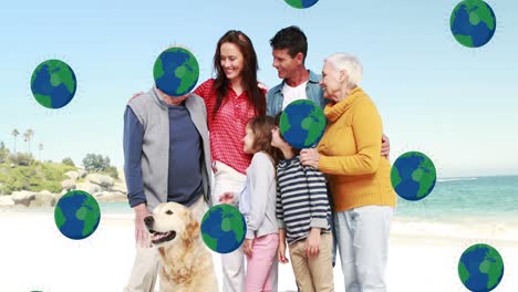 Animation-of-globe-icons-over-caucasian-family-at-beach
