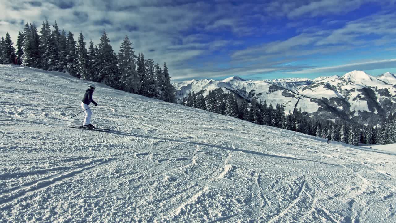 Enjoying skiing down the slope