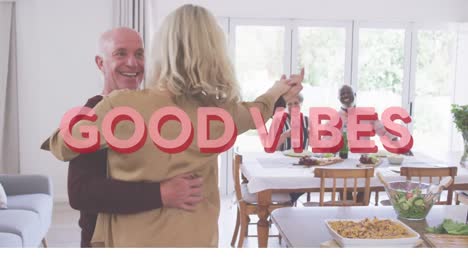 good vibes text against caucasian senior couple dancing together at home