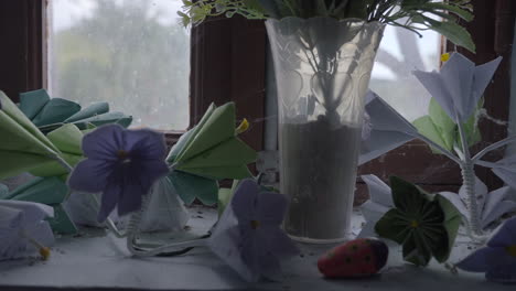 Old-origami---folded-paper-flowers-with-spider-webs