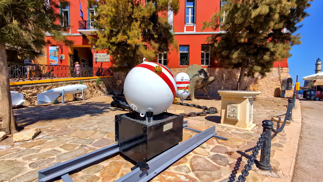 Historic naval mine on display outside a museum in Chania, Greece, on a sunny day