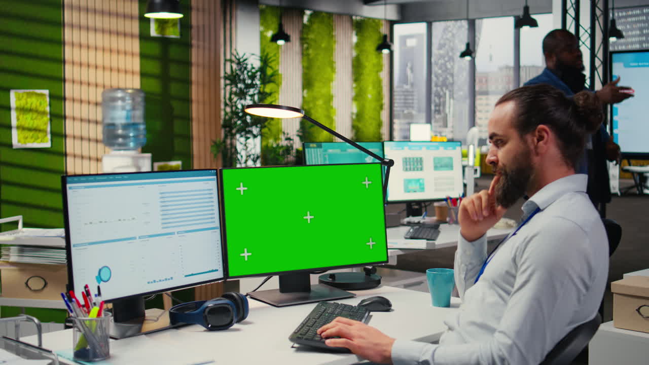 Vertical Video Young businessman reviewing financial data next to isolated mockup