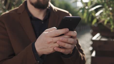 man using smartphone outdoors