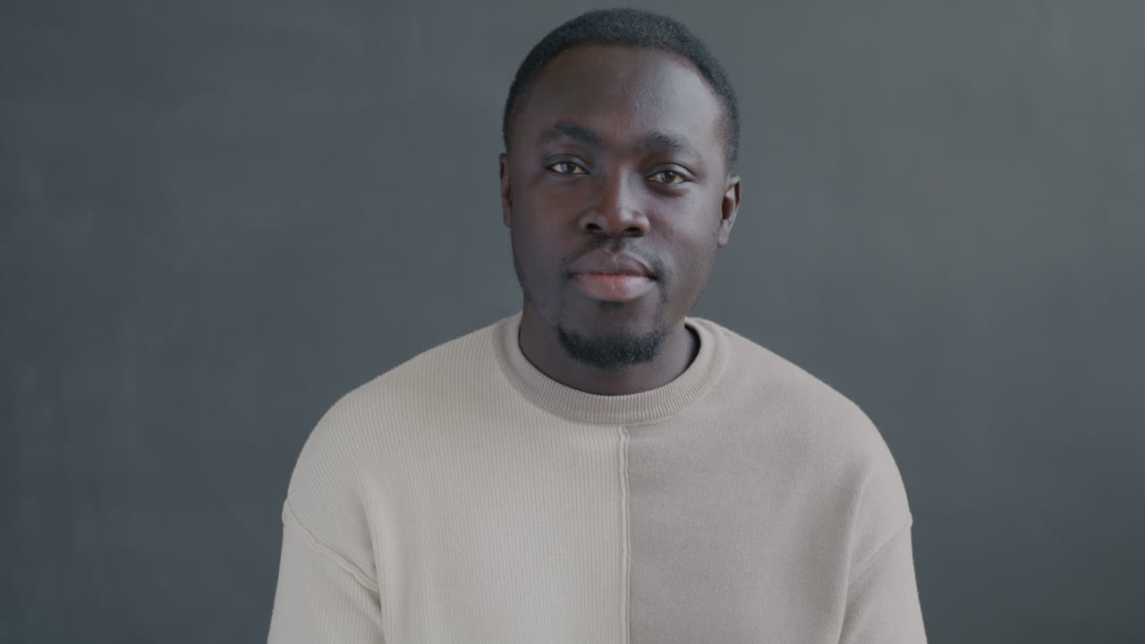 Surprised Man in Beige Sweater