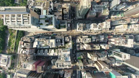 Central-Hong-Kong,-top-down-aerial-view-of-traffic-and-city-skyscrapers