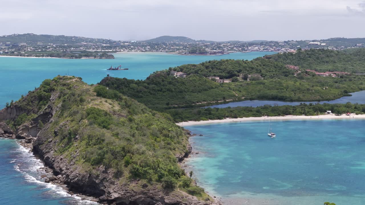 Lush Paradise Of Deep Bay Beach With Turquoise Water On Daytime In Antigua. aerial, wide shot