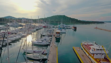 aerial over a dock with fishing boats and yachts in croatia