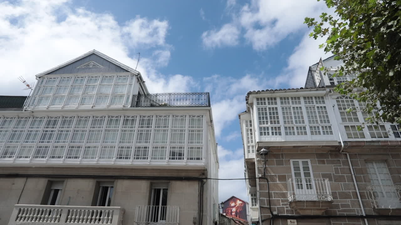 Galician Architecture: Charming White Building with Many Windows