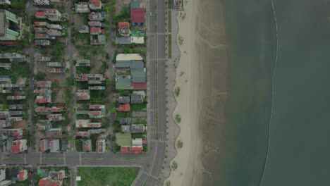 hạ long halong city houses, boat pier, beach in vietnam, aerial top-down view