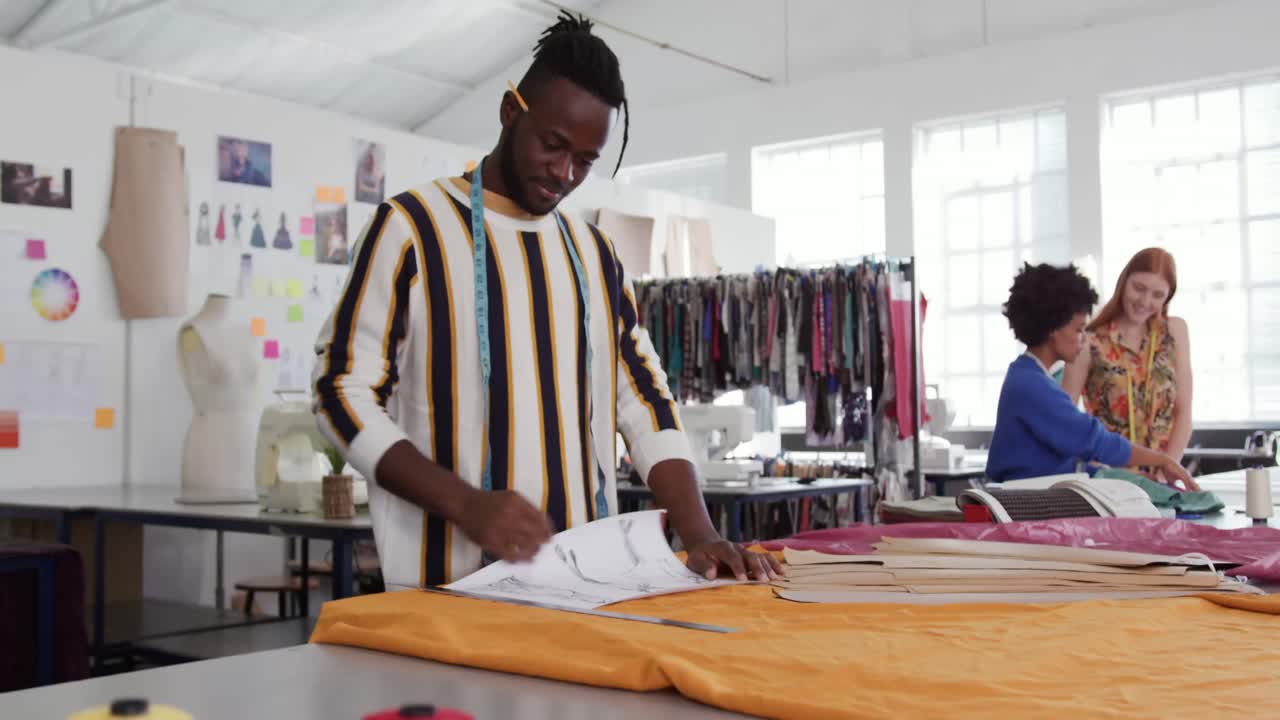 Mixed race man working in creative office