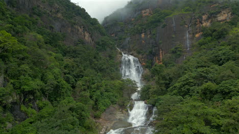 Rising-Establishing-Aerial-Drone-Shot-of-Ravana-Falls-on-Misty-Day-in-Ella-Sri-Lanka