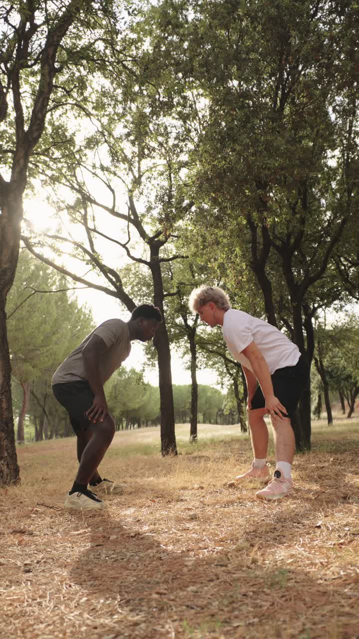 Two men exercising outdoors in a park