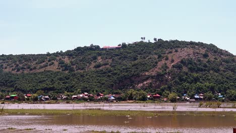 Wide-Shot-of-Phnom-Krom-Over-Water