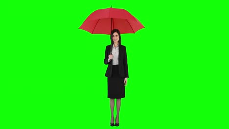 businesswoman standing under umbrella