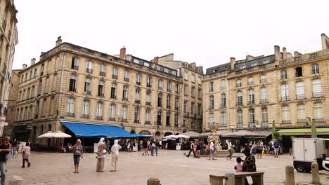 people enjoying a lively street in bordeaux