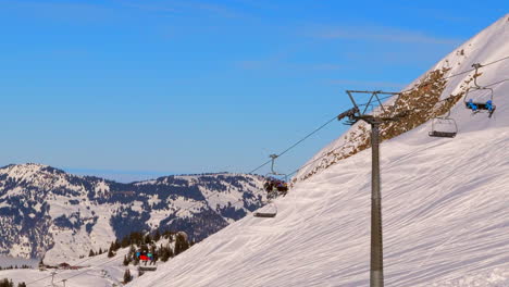 ski area in the swiss alps with people and chairlifts in the winter ski area of beckenried