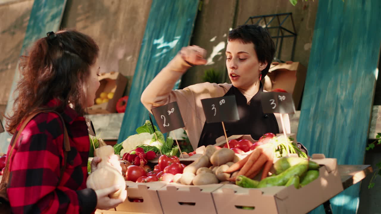 Women shopping for produce at a farmer's market