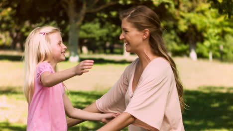 Woman-in-slow-motion-holding-her-daughter