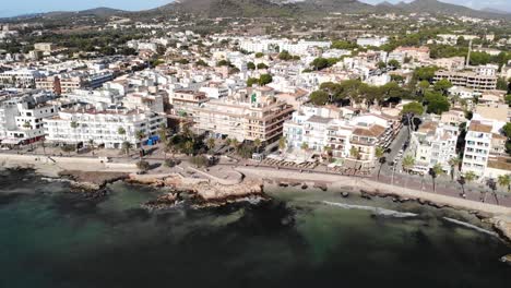 Aerial-View-of-Cala-Millor,-Promenade,-Coastal-Buildings-and-Hotels-on-Mallorca-Island,-Baleares,-Spain
