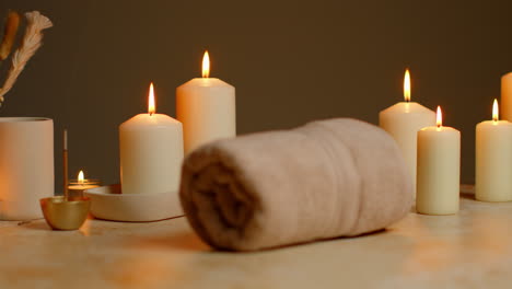 Still-Life-Of-Lit-Candles-With-Dried-Grasses-Incense-Stick-And-Soft-Towels-As-Part-Of-Relaxing-Spa-Day-Decor-7