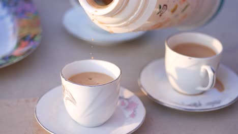 pouring tea from a thermos