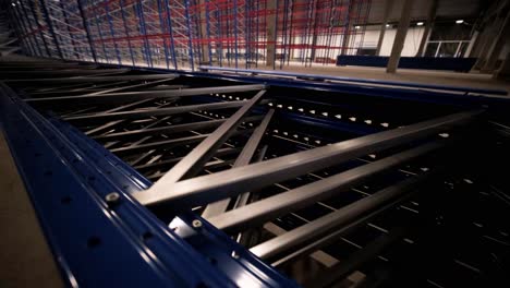 big and modern warehouse under construction, featuring metal shelving and other industrial equipment.