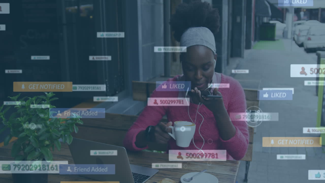 Animation of social media notifications over african american woman using smartphone at street cafe