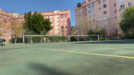 tennis player powerfully forehand ball over net