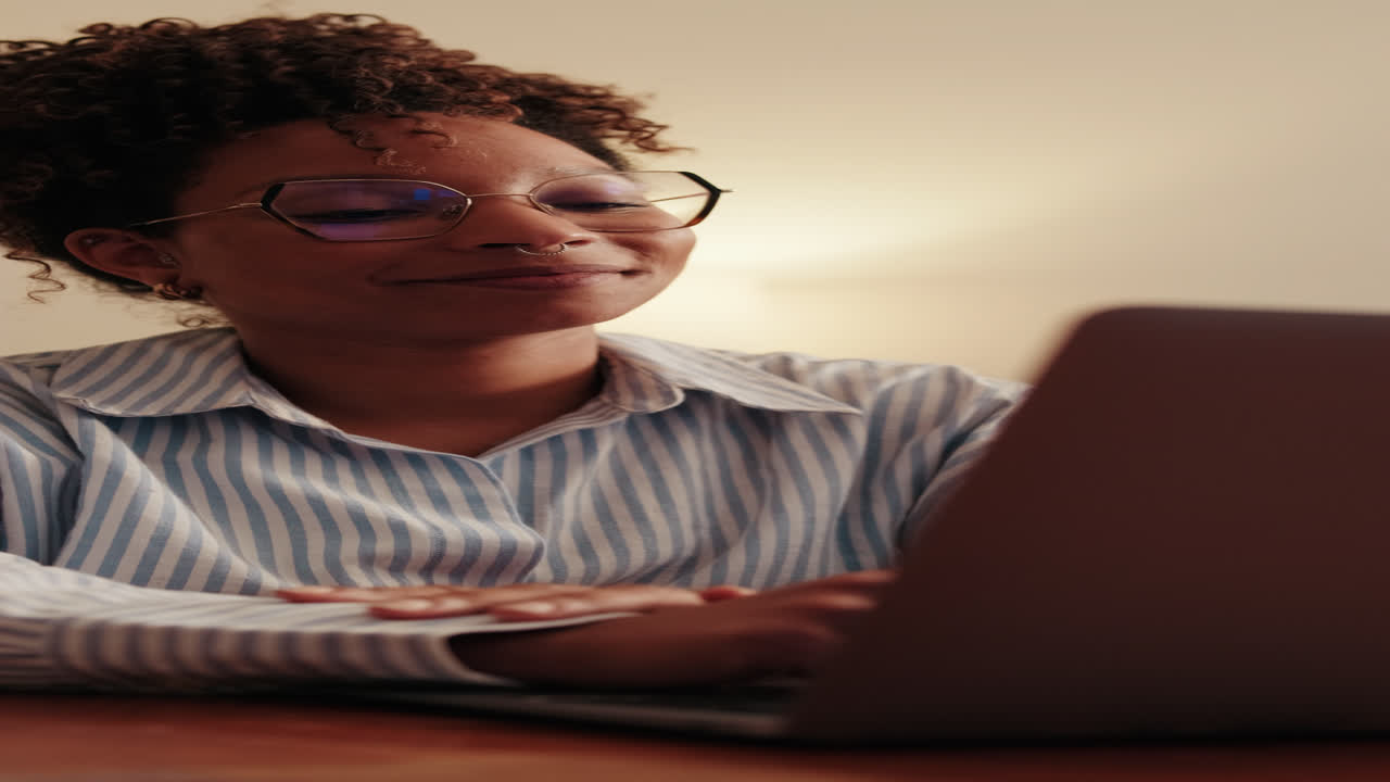 Woman Working From Home on Laptop and smiling. Close up