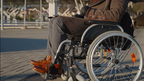 person in wheelchair outdoors