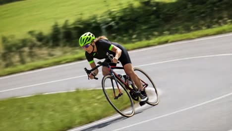 a cyclist in full motion navigating a curved road with precision, showcasing speed and control in a scenic outdoor setting