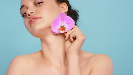 Face,-flower-and-woman-with-skincare