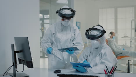 orthodontist and assistant using x ray of teeth for oral care