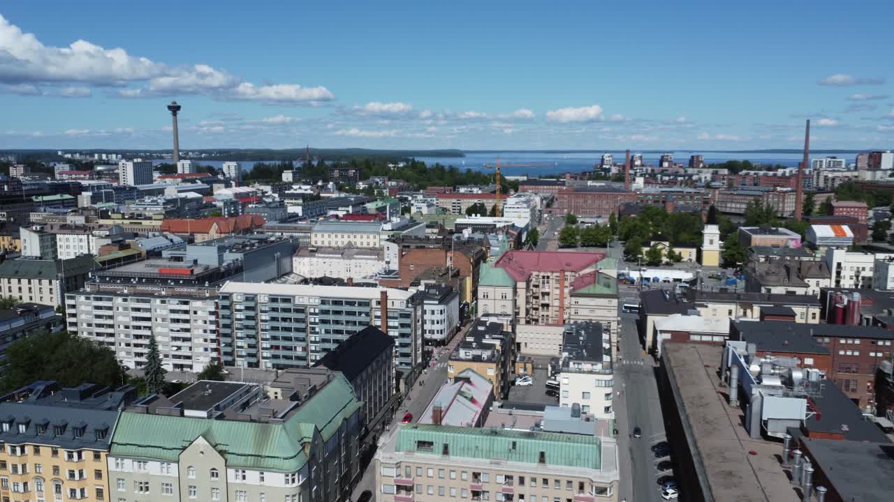 Low flyover of lakefront old Europe downtown of Tampere, Finland