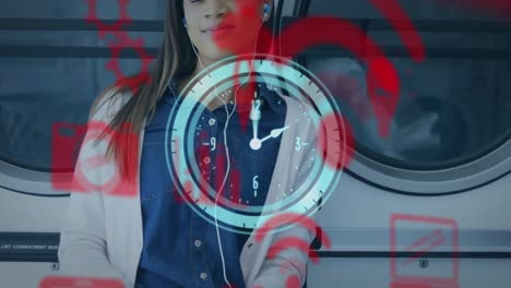 Composite-video-of-smiling-biracial-young-woman-listening-music-at-laundromat-and-clock-icon