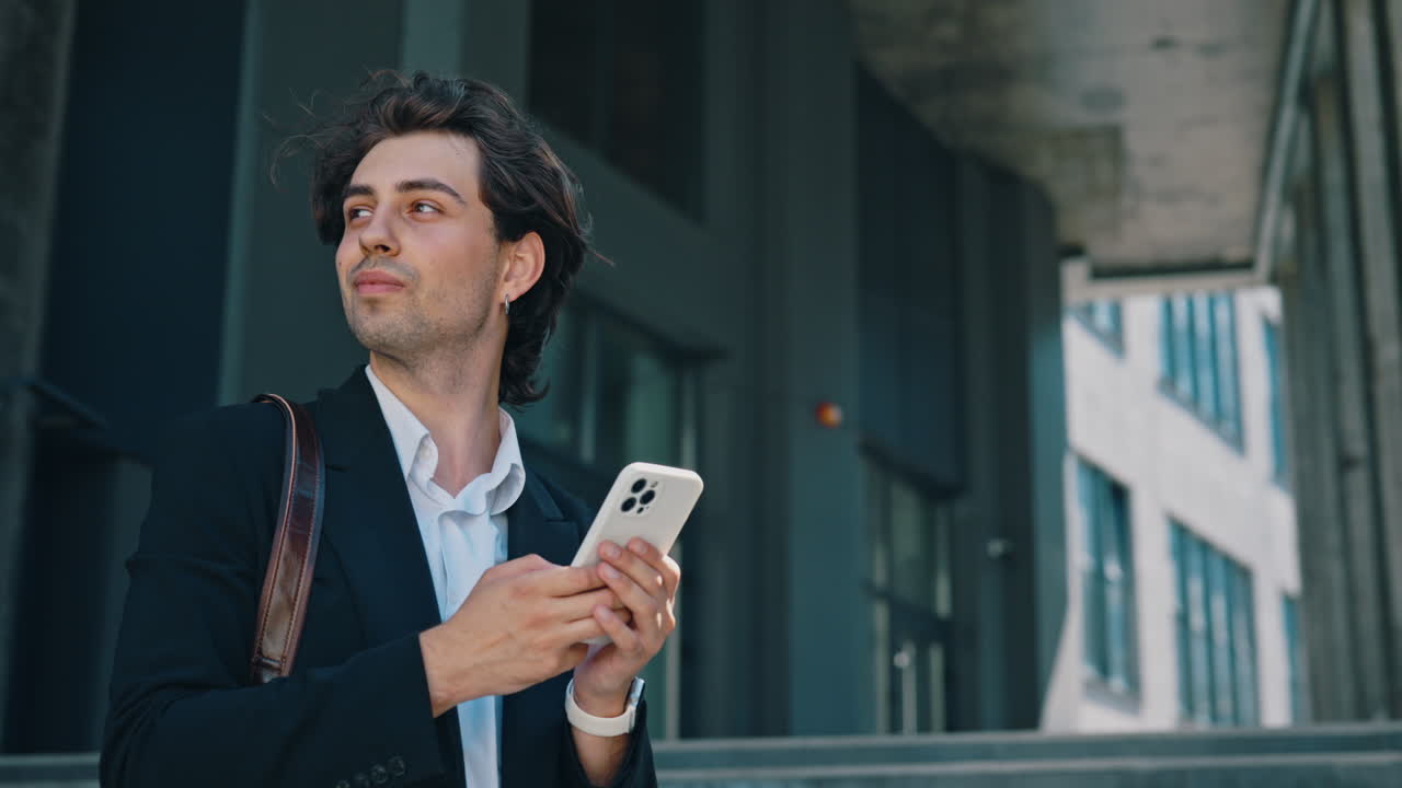 Young Businessman Using Smartphone Outdoors