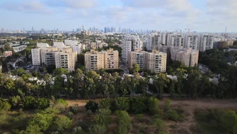 a drone flying from independence park towards the skyline of central tel aviv