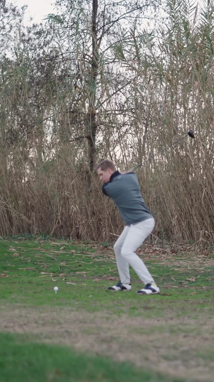 Golfer Swinging Golf Club