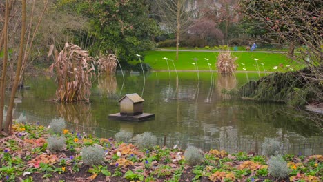 tranquil pond at jardin des plantes d'angers park in angers, france - wide